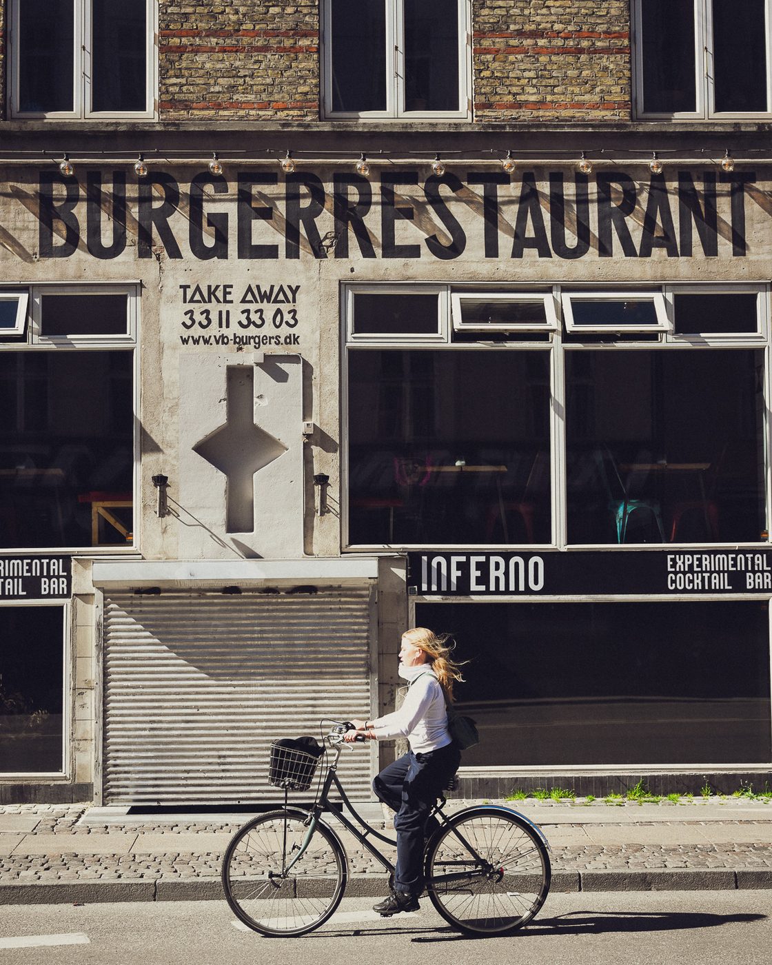 Facaden på Istedgade 34–36 med BURGERRESTAURANT malet hen over murværket